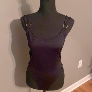 Body suit with cut out sides